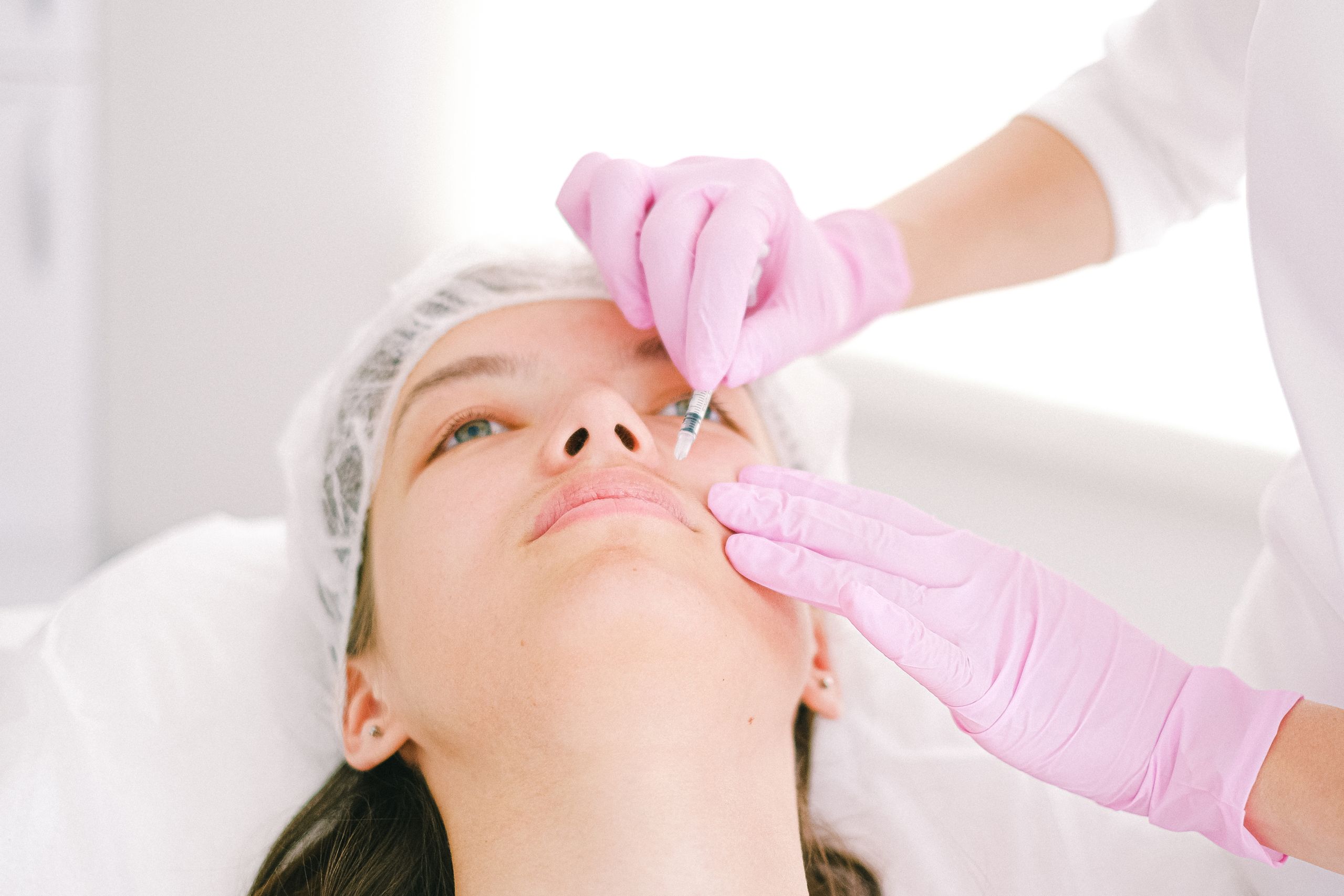 Woman receiving facial injection